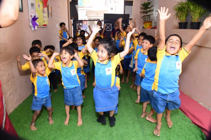 Children coloring during creative preschool activity